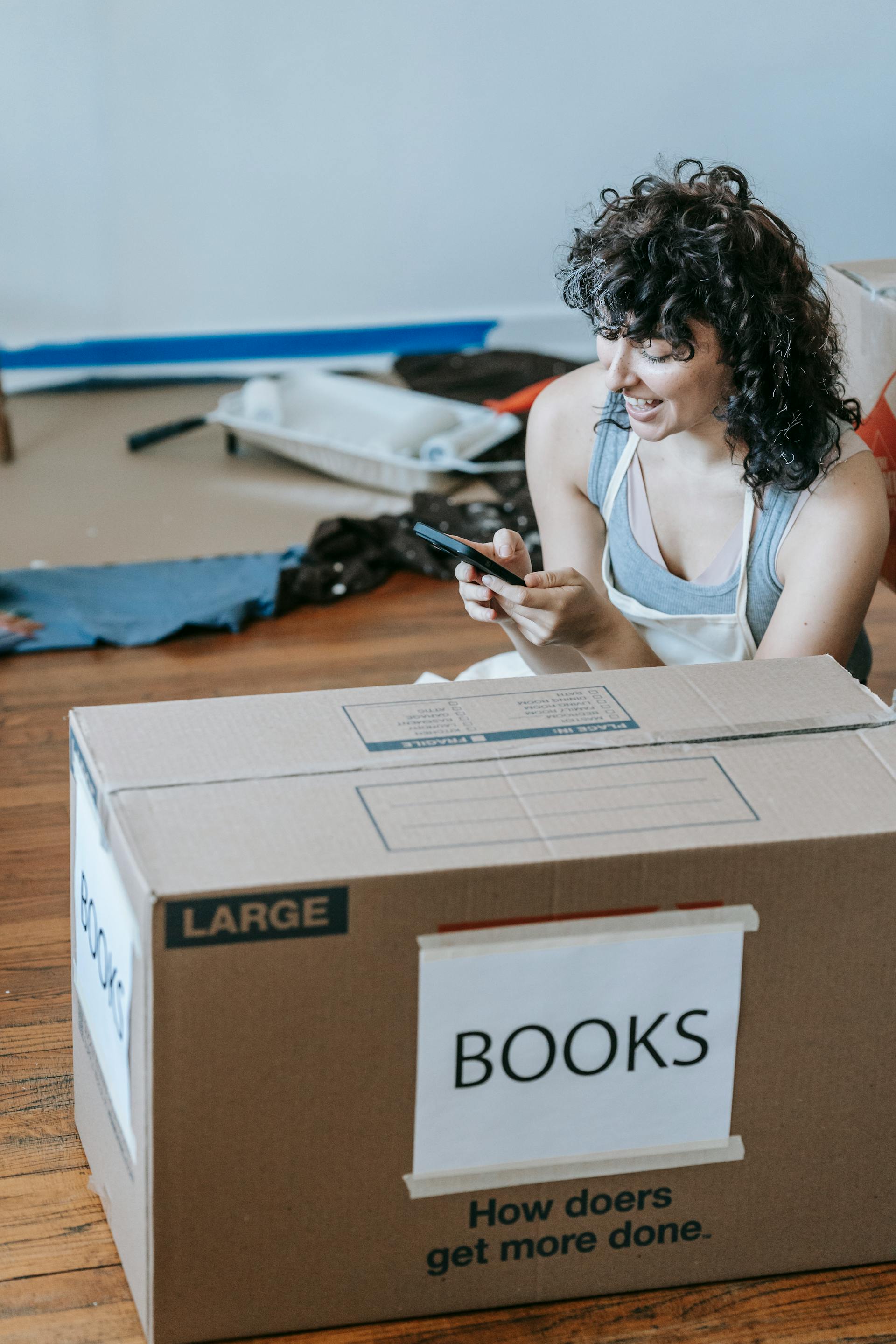 Person packing belongings for storage